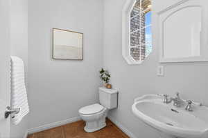 Bathroom featuring baseboards and tile patterned floors