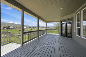 Wooden porch with a mountain view and a residential view