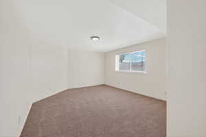 Spare room with carpet flooring and baseboards