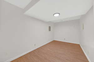 Spare room with light wood-style floors and baseboards