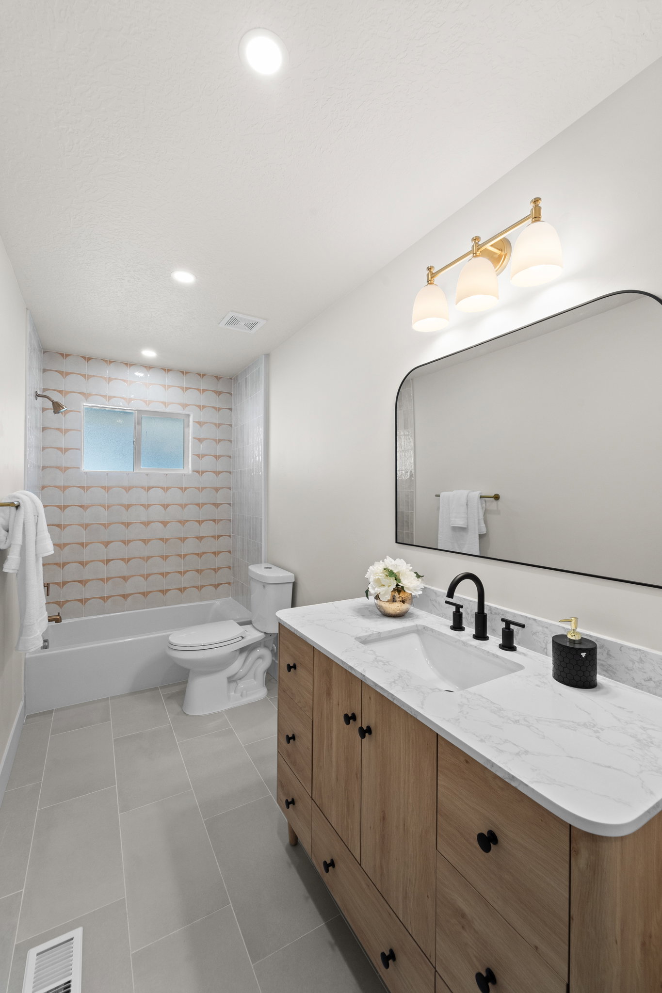 Full bathroom with vanity, shower / washtub combination, recessed lighting, and light tile patterned floors