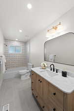 Full bathroom with vanity, shower / washtub combination, recessed lighting, and light tile patterned floors