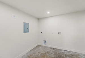 Laundry room with concrete flooring, electric panel, washer hookup, electric dryer hookup, and recessed lighting