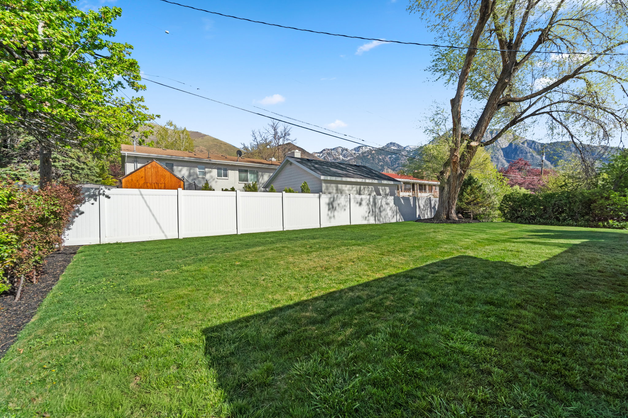 Fenced yard with a mountain view