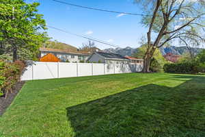 Fenced yard with a mountain view