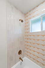 Bathroom with shower / bath combination