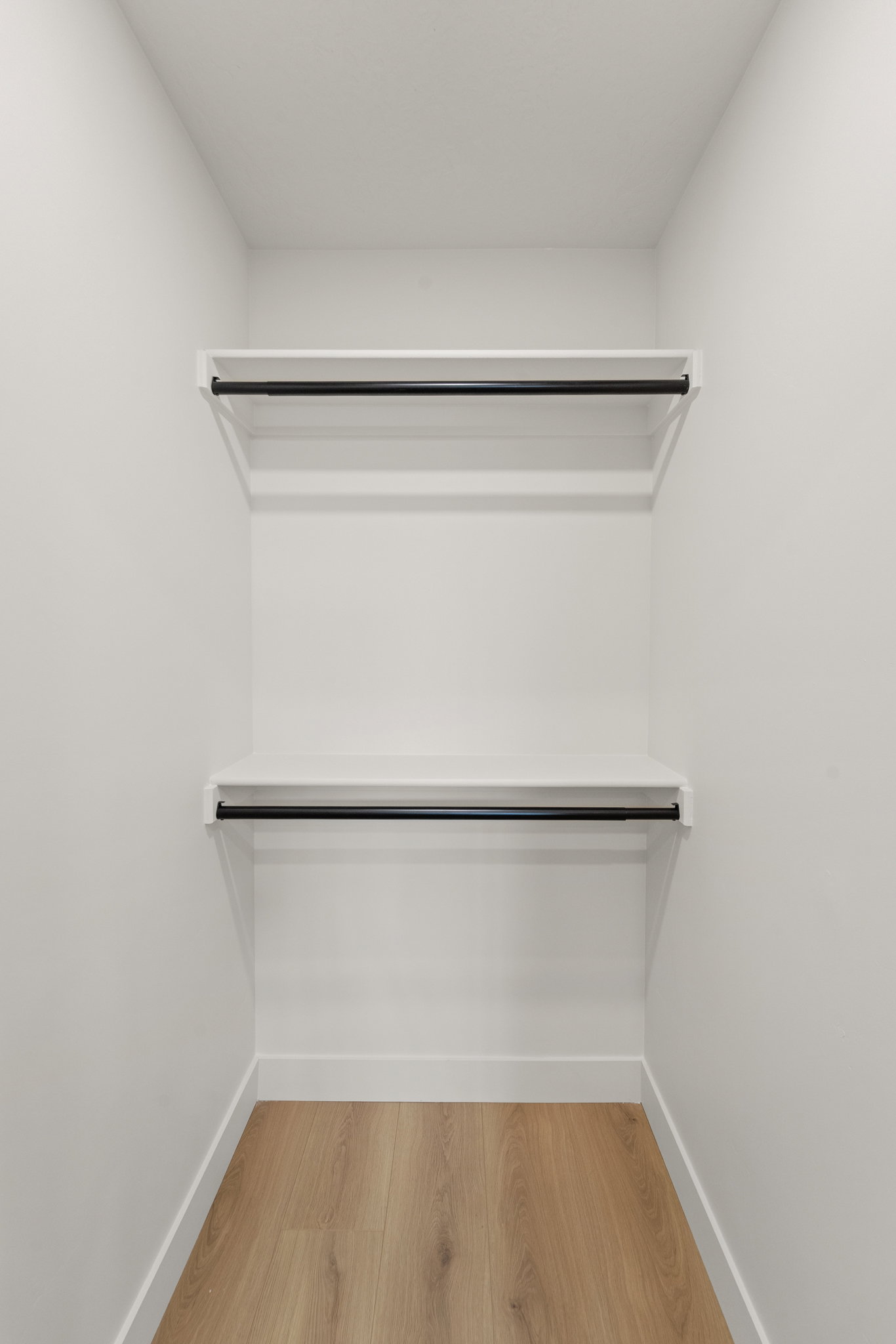 Walk in closet featuring light wood-type flooring