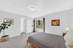 Bedroom with baseboards and carpet