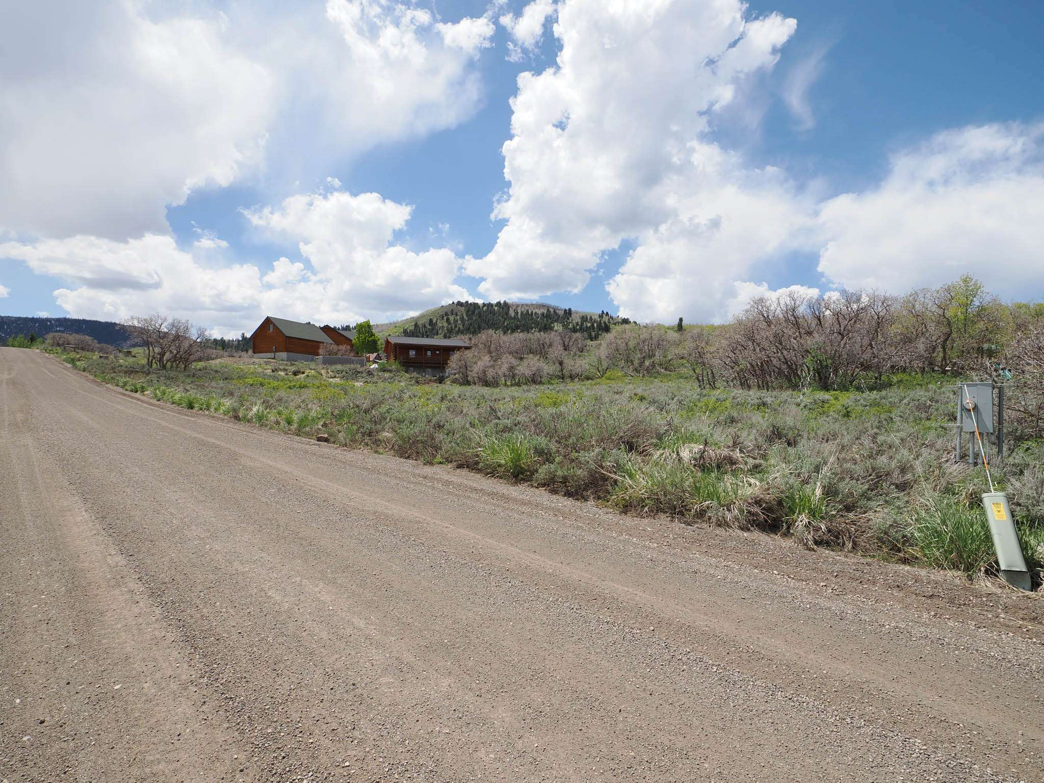 View of gravel road featuring a rural view