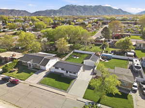 Aerial perspective of suburban area with a mountainous background