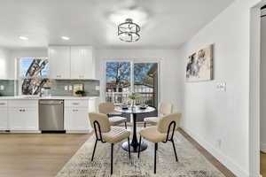 Dining room featuring light wood-style floors and recessed lighting