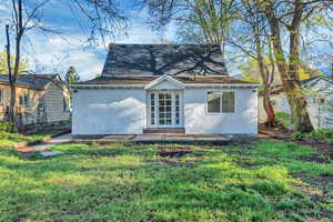 Back of house featuring french doors, stucco siding, and a patio area