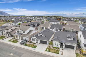 Aerial view of residential area featuring a mountain backdrop
