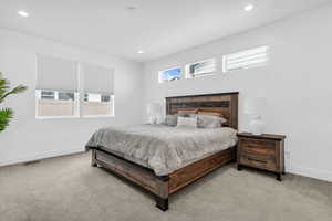 Bedroom with carpet floors and recessed lighting