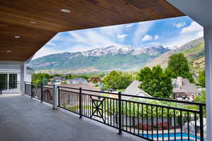 Balcony with a residential view and a mountain view