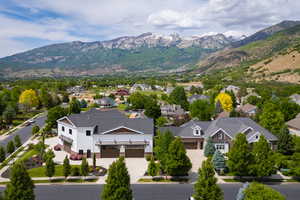 Aerial perspective of suburban area featuring a mountain backdrop