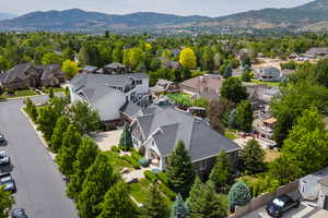 Aerial perspective of suburban area featuring a mountainous background