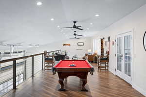 Game room with a ceiling fan, lofted ceiling, dark wood-style flooring, pool table, and recessed lighting