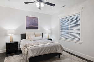 Bedroom featuring baseboards and ceiling fan