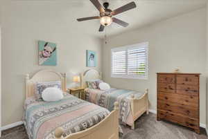 Bedroom featuring carpet flooring and a ceiling fan