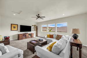 Living area featuring carpet floors, recessed lighting, and a ceiling fan