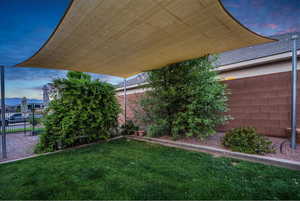 Yard at dusk with a fenced backyard