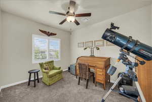 Carpeted office space featuring baseboards