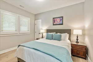 Bedroom featuring baseboards and light wood-style floors