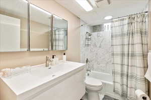 Full bath with vanity and shower / bath combo