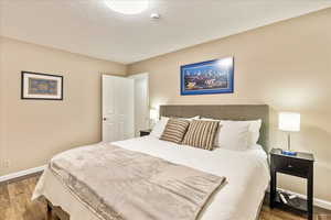 Bedroom with wood finished floors