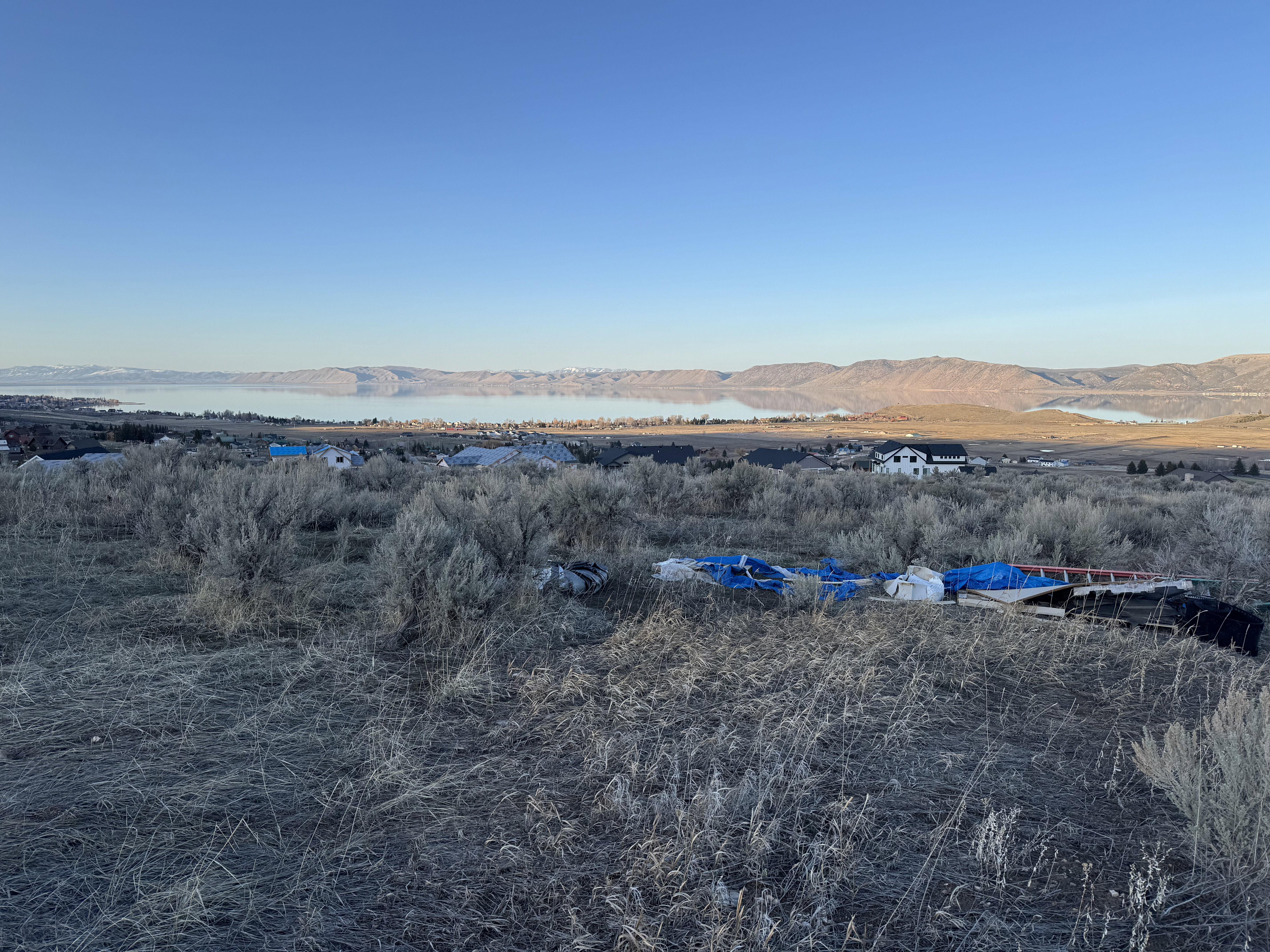 View of yard with a water and mountain view