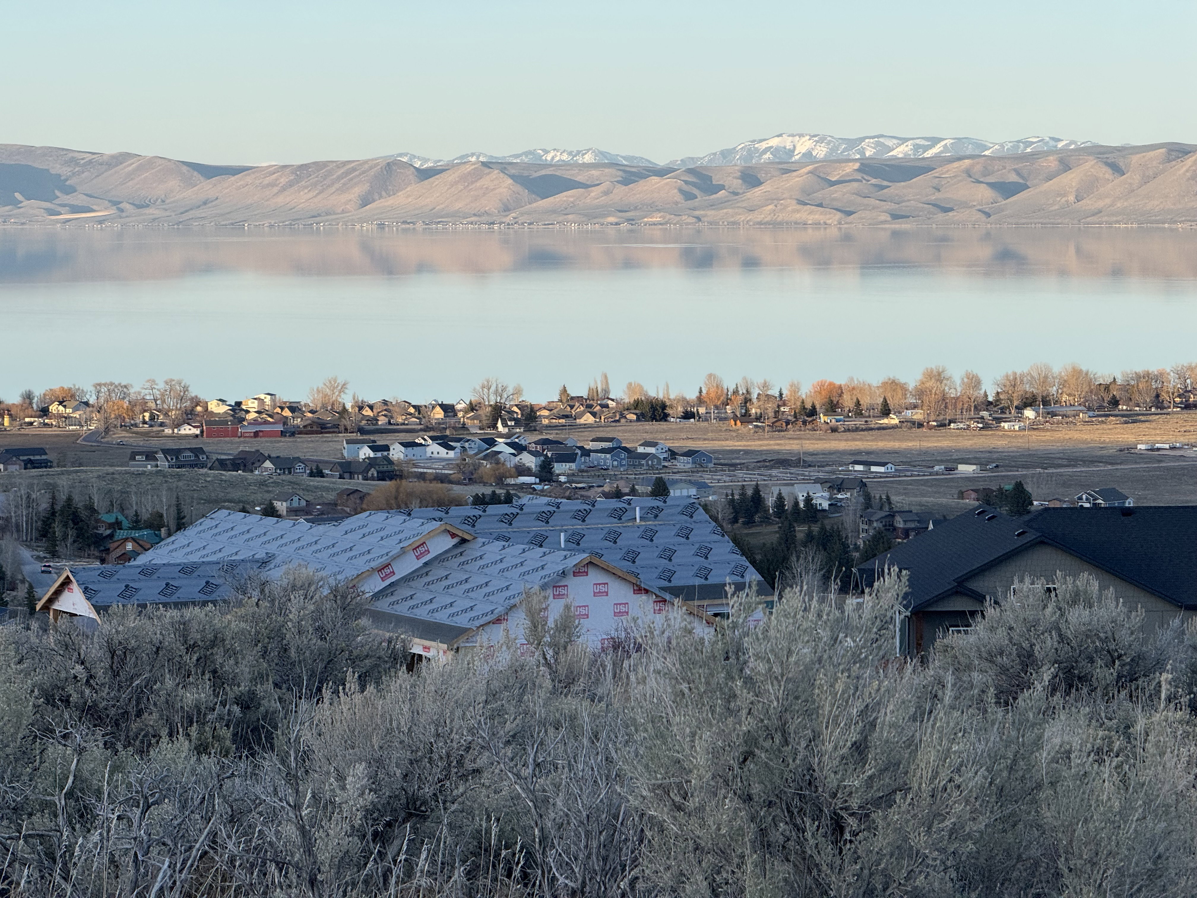 Water view with mountains and nearby suburban area