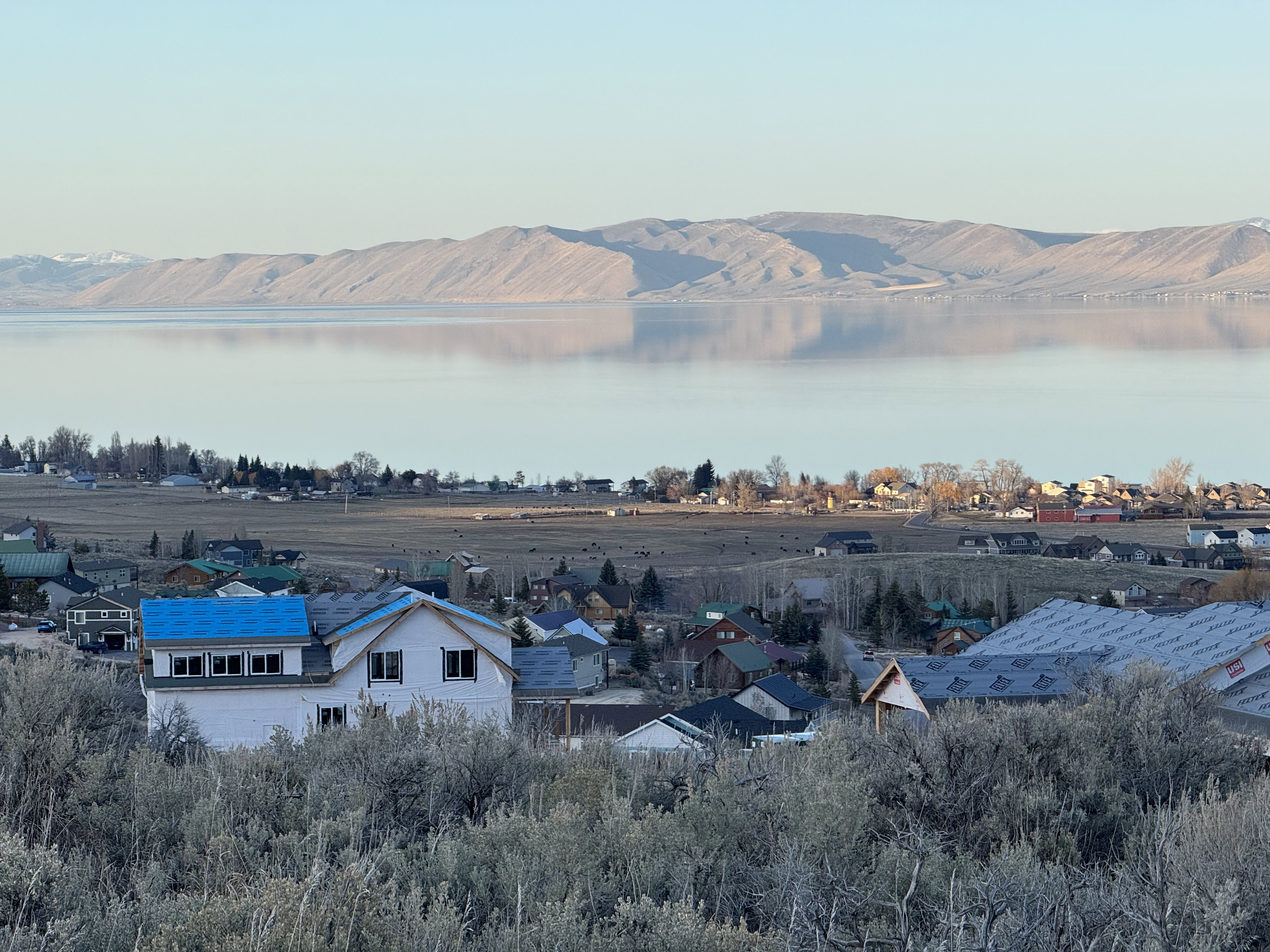 Aerial view of residential area with a water and mountain view