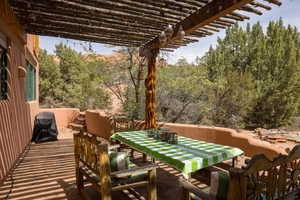 View of patio / terrace with a pergola, outdoor dining area, and area for grilling