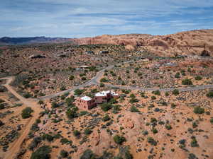 Aerial view of sparsely populated area featuring a desert landscape and a mountain backdrop