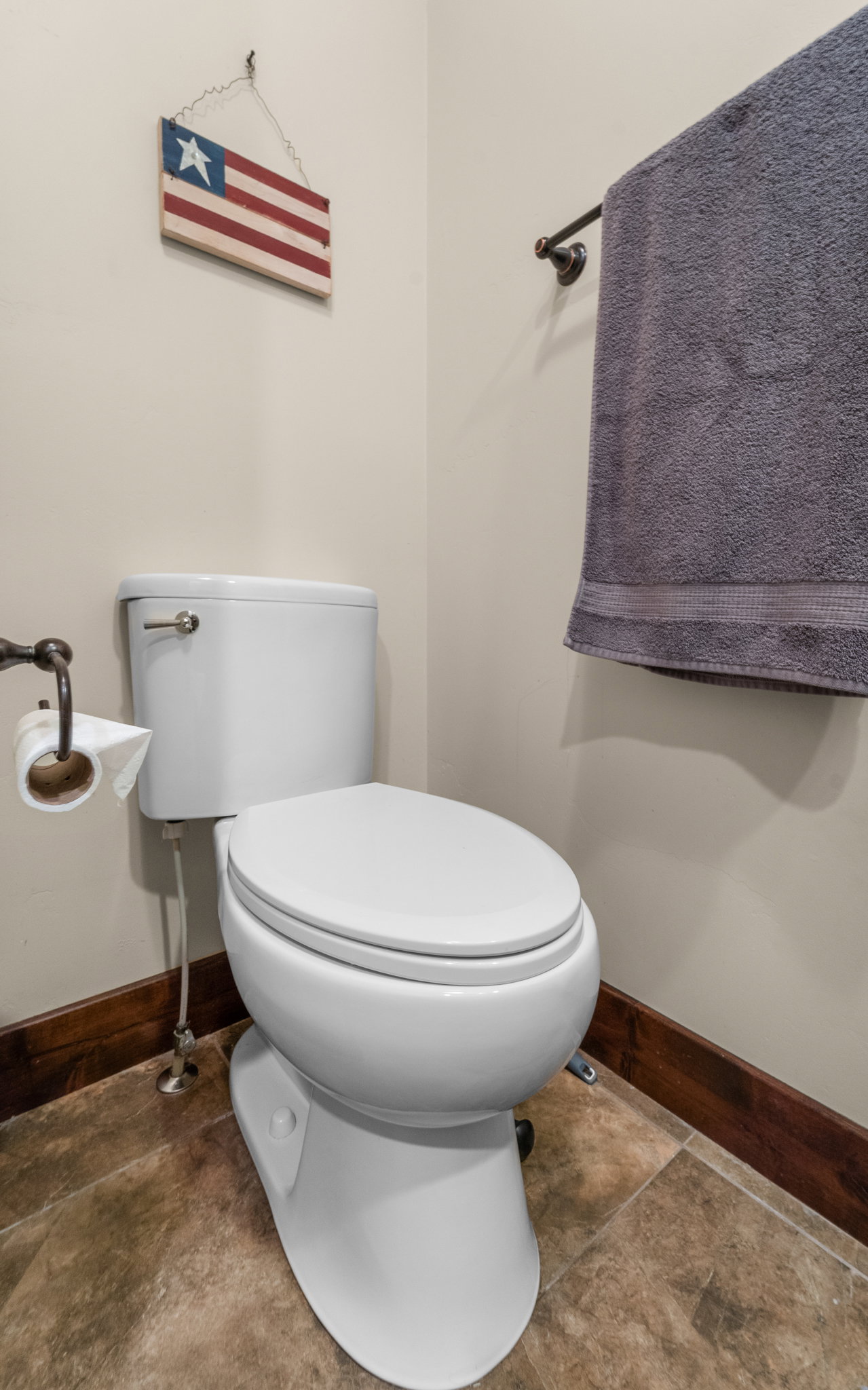 Bathroom featuring toilet and baseboards