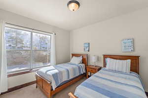 Carpeted bedroom with baseboards