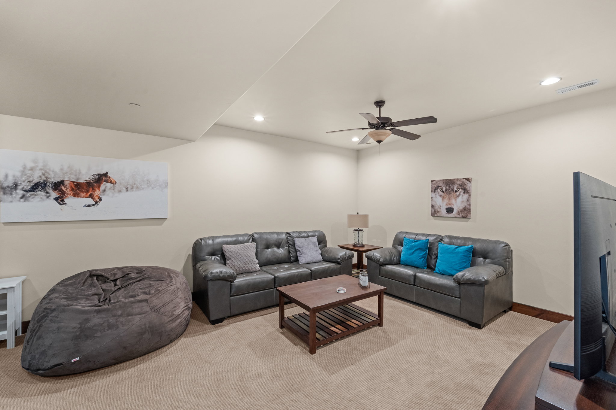Living area featuring recessed lighting, ceiling fan, and carpet floors