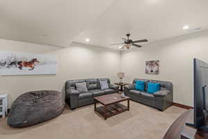 Living area featuring recessed lighting, ceiling fan, and carpet floors
