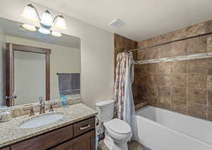 Full bathroom with vanity and shower / bath combo