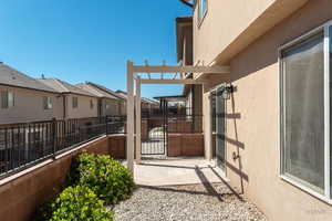 View of patio / terrace featuring a gate, a residential view, and a pergola
