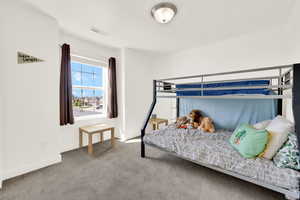 Bedroom with carpet and baseboards