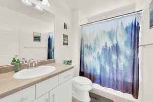 Full bathroom with vanity and toilet