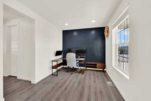 Office space featuring recessed lighting and light wood-style floors