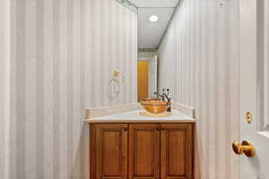 1/2 Bath near kitchen and back door to pool.