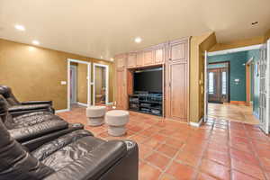 Theater Area with TV, 4 Chairs and Wet Bar.