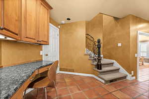 Small office area off the kitchen and near 2nd stairway to upper level.