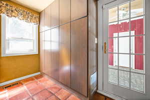 Mud Room with Storage and breezeway to garage.