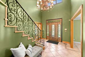 Foyer entrance with ornate railing.