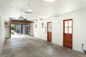 Garage featuring baseboards